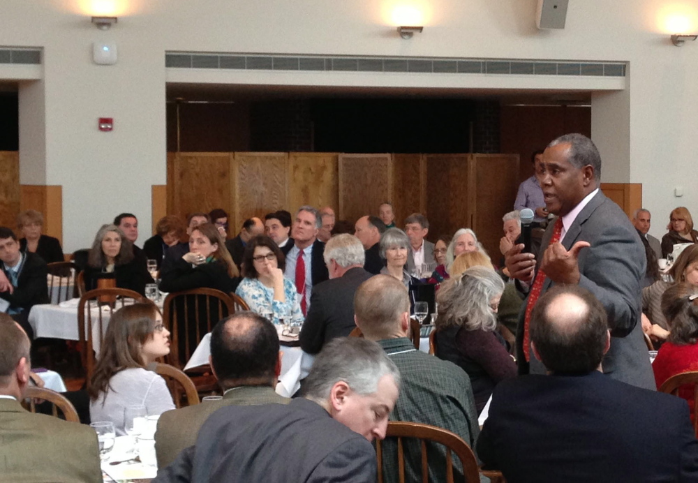 Steve Curwood speaks at Coastal Enterprise Inc.’s annual meeting at Bowdoin College on Tuesday. “We know what our mission is: We need to take care of the creatures that have evolved along with us,” he said.