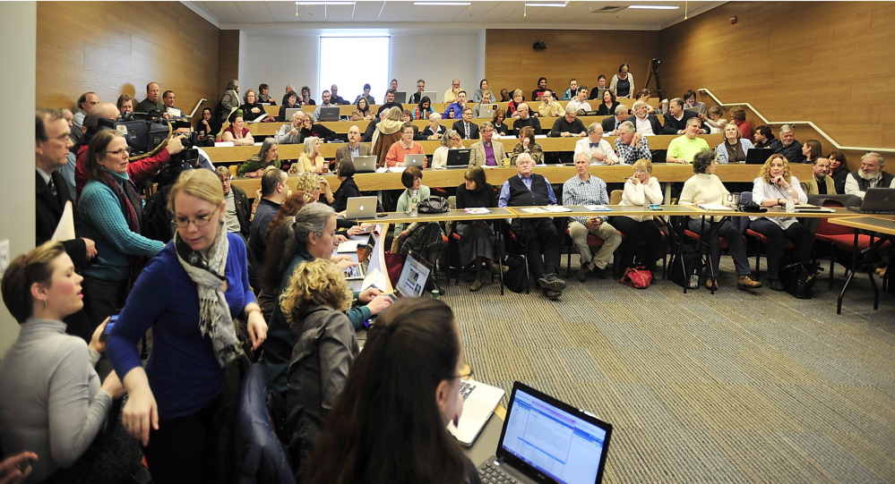 A crowd of professors and instructors gathers at a Faculty Senate meeting Friday to hear USM President Theodora Kalikow announce cuts to the school’s budget which could result in as many as 50 faculty and staff layoffs.