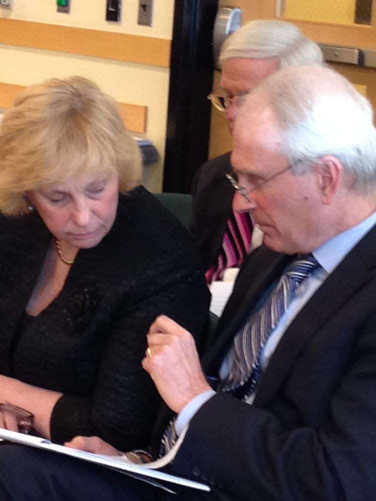 CDC Director Sheila Pinette consults with her attorney Gaydon Stevens as she prepares to testify before the Government Oversight Committee on Friday in Augusta.