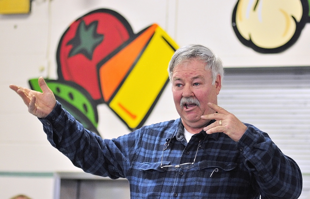 At their disposal: Daniel Taggert speaks on Saturday during a debate about trash hauling at the Pittston town meeting in the Pittston Consolidated School.