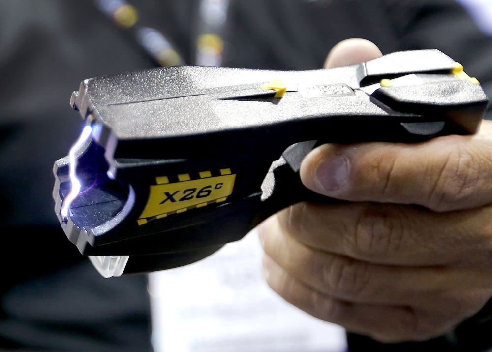 G Squared Consulting CEO Alex Solis demonstrates an electroshock weapon at the Border Security Expo in Phoenix. G Squared Consulting creates clothing that is resistant to electroshock weapons.