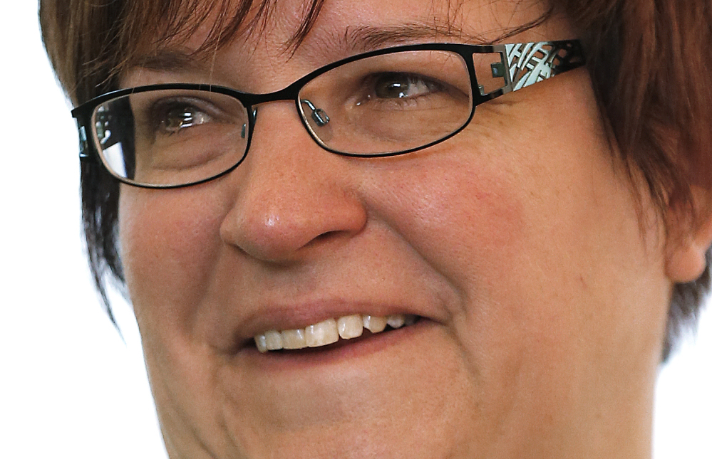 April DeBoer smiles with tears during a news conference in Ferndale, Mich., Friday, March 21, 2014. A federal judge has struck down Michigan's ban on gay marriage Friday the latest in a series of decisions overturning similar laws across the U.S. The two nurses who've been partners for eight years claimed the ban violated their rights under the U.S. Constitution. (AP Photo/Paul Sancya)