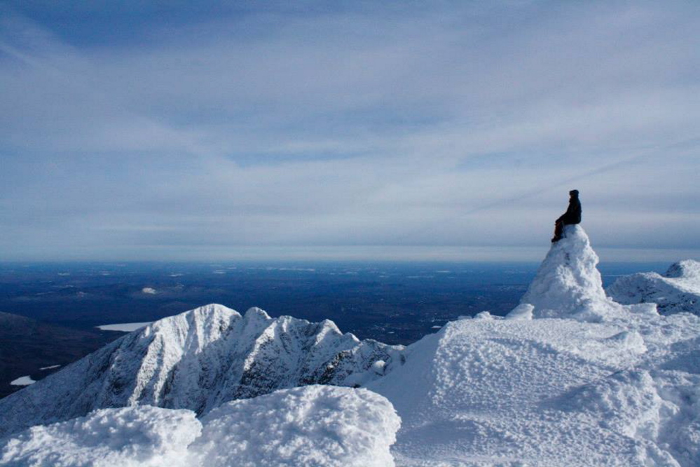 Contributed photos by Bo Willoughby Tyler Heinrich, of Albion, checks out the view surrounding Mt. Katahdin from Baxter Peak. Heinrich and Bo Willoughby, a Winslow native and Belgrade resident, hiked Mount Katahdin in the heart of winter, spending two nights in temperatures that dipped to well below zero.