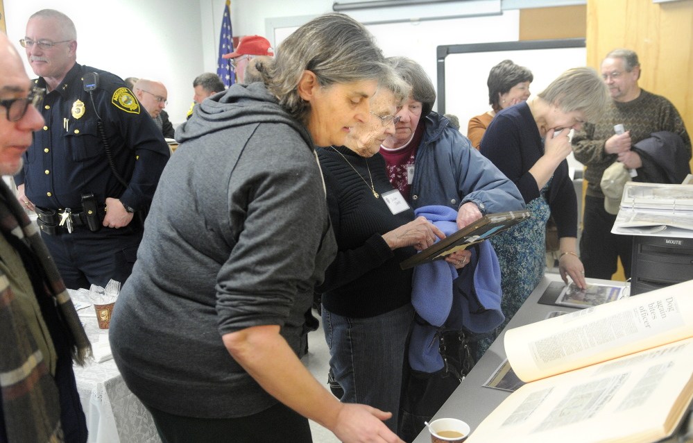 STILL ON THE BEAT: Guests at the party for the Augusta Police Department’s 164th birthday examine historical items from the agency during the celebration at the Augusta police station. The first city marshal was appointed March 27, 1850. The date was discovered during recent efforts to track down department history.