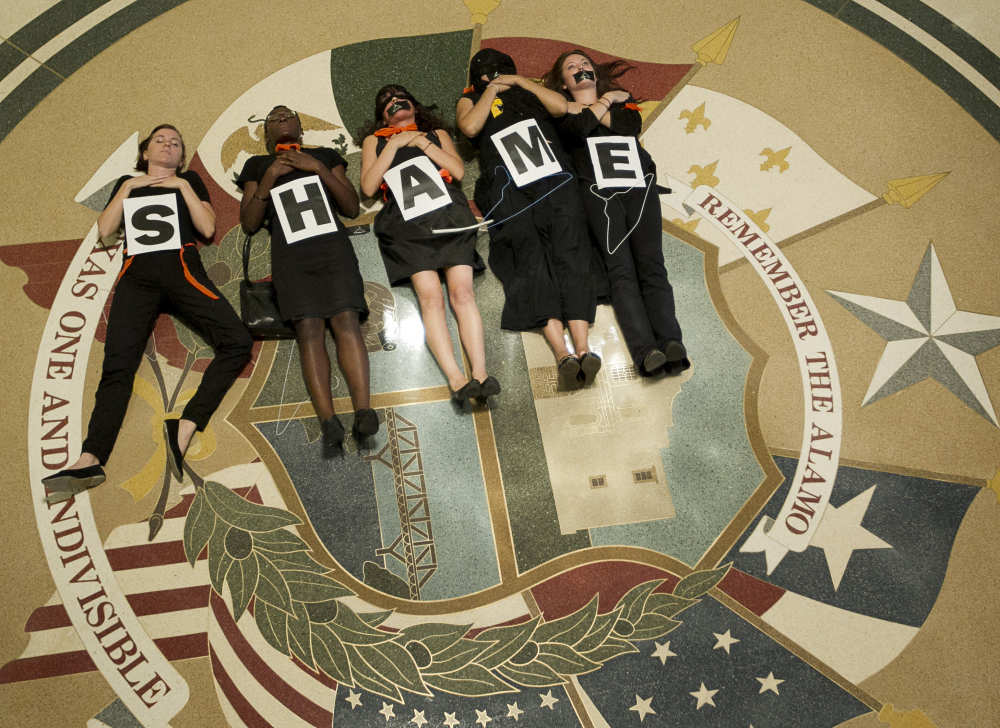 Abortion rights supporters demonstrate outside the Capitol auditorium in Austin, Texas, on July 18, 2013, after Gov. Rick Perry signed sweeping abortion restrictions that forced the closure of several clinics.