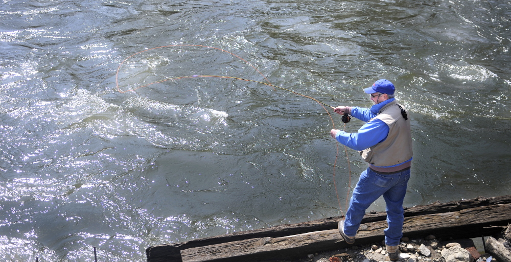 OPEN WATER: State and federal officials met Wednesday to discuss the flood risk of the Kennebec River, where Tom Bouchard of Farmingdale fished at the confluence of Cobbossee Stream in Gardiner.