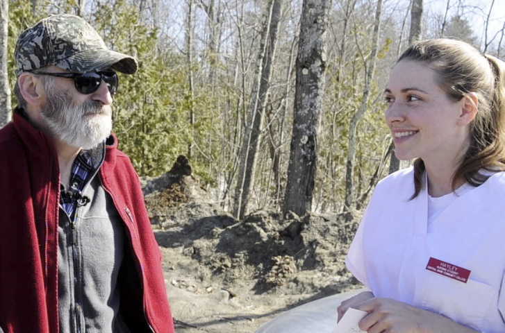 ANGEL IN SCRUBS: Leonard Crocker, left, and Hayley Rolfe answer questions from reporters after they met on Friday at Monmouth Public Works. Rolfe, a nursing student, stopped to help several weeks ago when Crocker was having a heart attack along the side of the road.