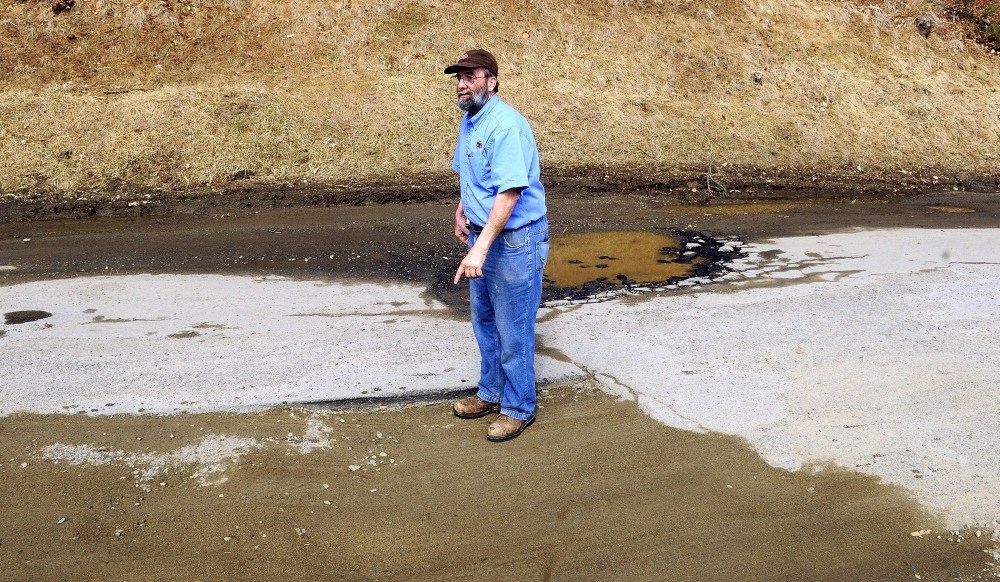 BAD ROADS: Bill Marson talks about the rough condition of Sparrow Drive in the Riverside Drive Village on Thursday in Augusta.