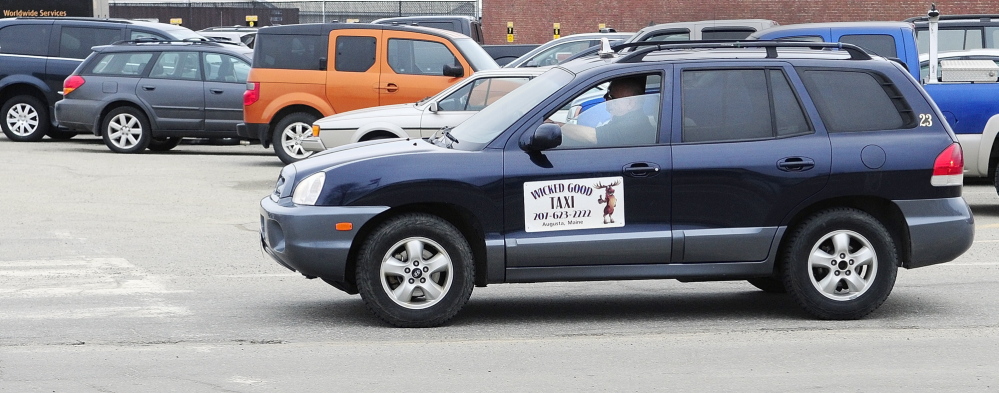 Risky job: Paul Marquis drives a cab for his business, Wicked Good Taxi, on Wednesday in Augusta.