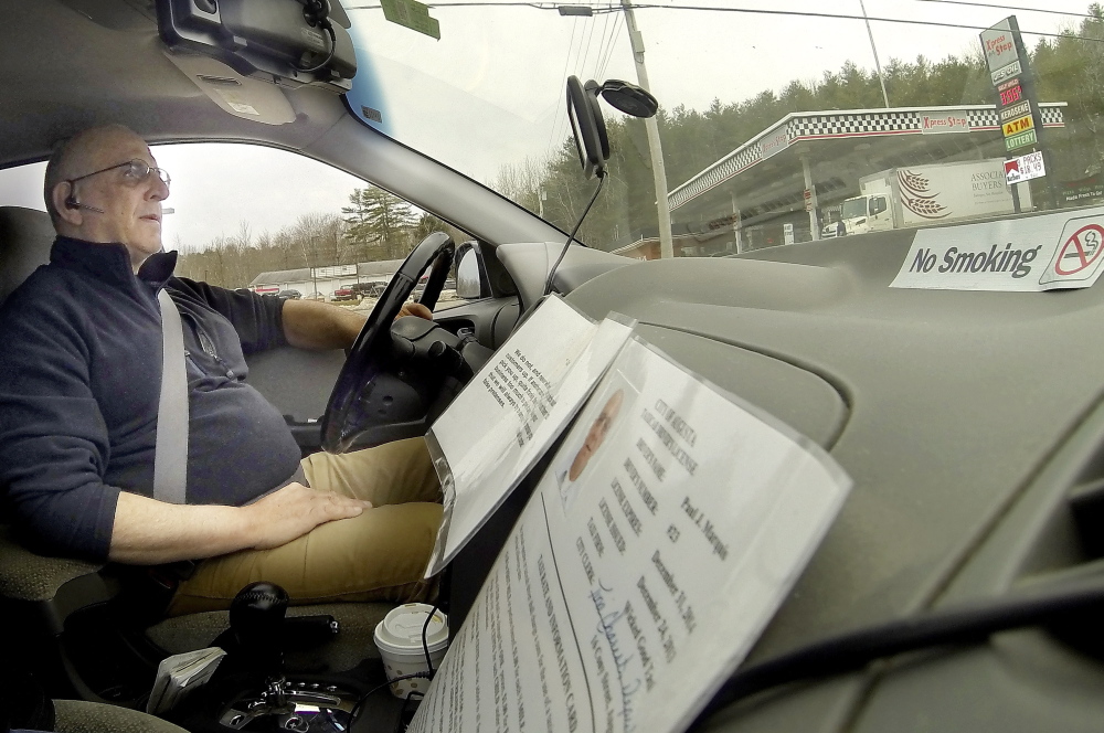 Man about town: Paul Marquis drives a cab for his business, Wicked Good Taxi, on Wednesday in Augusta.