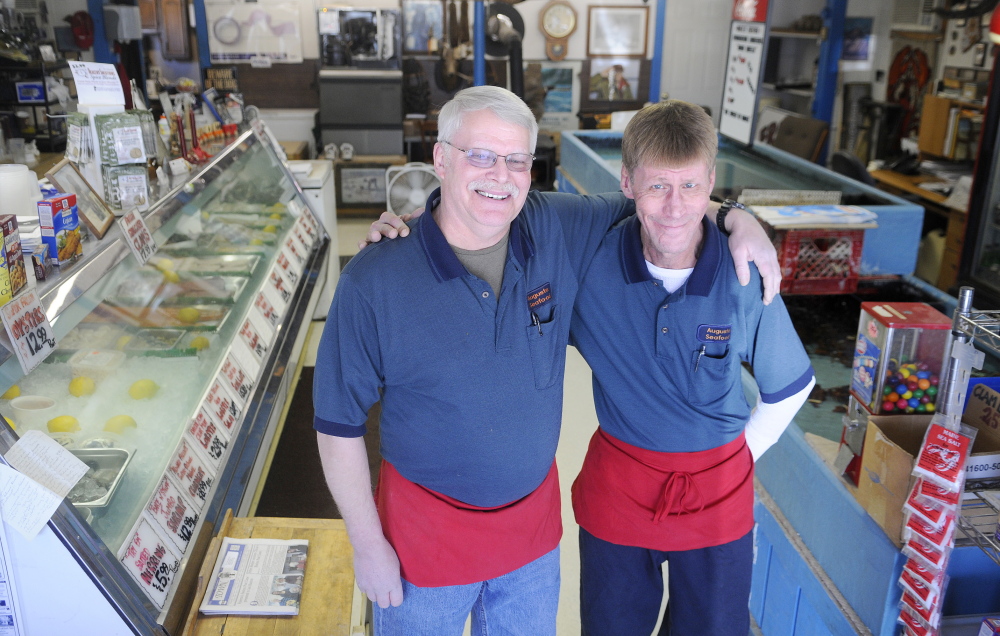 GONE FISHIN’: Robert Benedict, left, and his brother, Jeff, are retiring rom the business, Augusta Seafood, that their family has operated in Augusta since the 1970s, and have put it up for sale.