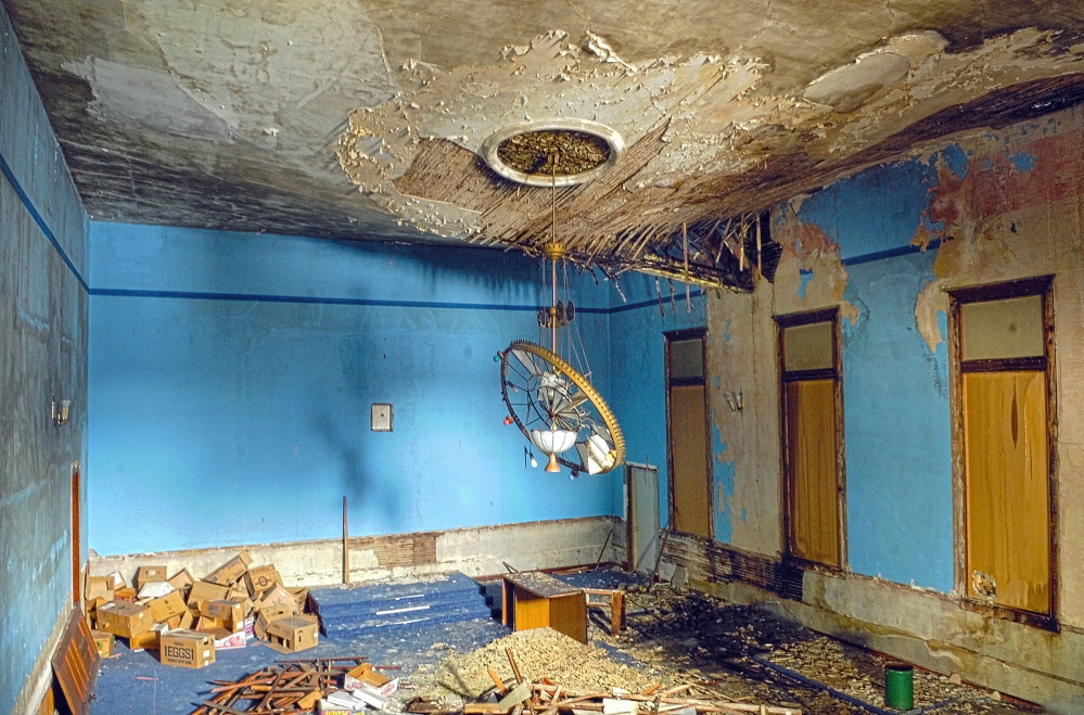 DETERIORATION: A roof beam can be seen cracking through the ceiling in the old Masonic Hall on Tuesday in Winthrop. Library director Richard Fortin said that the beam wasn’t like that the last time he was in the building about a week ago. The hal is scheduled to be demolish to make room for a wing on the adjacent C.M. Bailey Public Library.