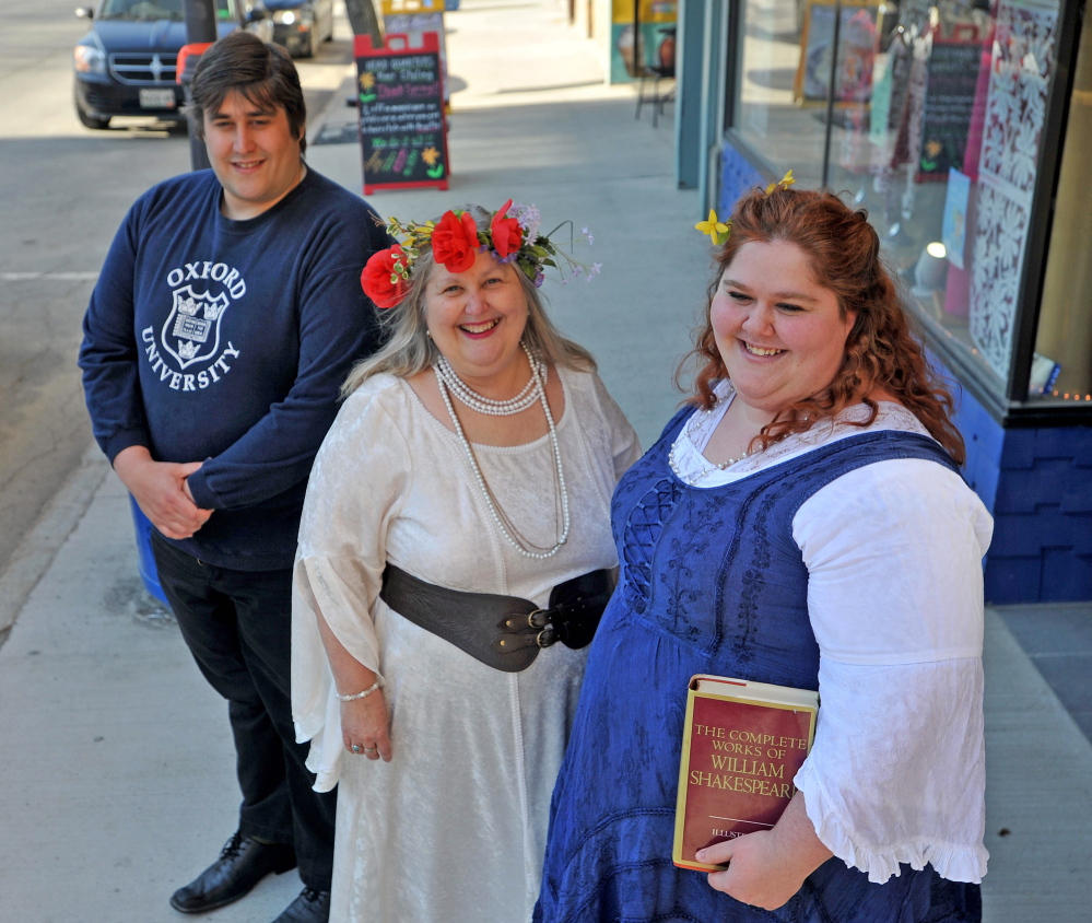 THE WORLD’S A STAGE: Lyn Rowden, center with her son Aaron, left, and Emily Rowden Fournier, right, stand on Main Street in downtown Waterville, where they will hold a 450th birthday party for Shakespeare on April 23, at which all of his 154 sonnets will be recited.