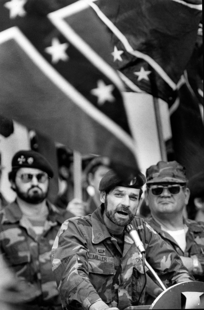 In this Feb. 24, 1985 file photo, Carolina Knights of the Ku Klux Klan leader Glenn Miller addresses members in front of the North Carolina General Assembly in Raleigh. Miller also known as Frazier Glenn Cross is suspected of fatally shooting two people Sunday afternoon in the parking lot behind the Jewish Community Center of Greater Kansas City, then driving to a retirement community where he shot a third person. He was arrested in an elementary school parking lot.