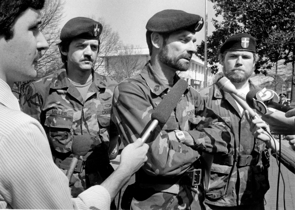In this March 19, 1985 photo Glenn Miller, of the Carolina Knights of the Ku Klux Klan holds a news conference in front of the North Carolina General Assembly in Raleigh. Miller also known as Frazier Glenn Cross is suspected of fatally shooting two people Sunday afternoon in the parking lot behind the Jewish Community Center of Greater Kansas City, then driving to a retirement community where he shot a third person. He was arrested in an elementary school parking lot.