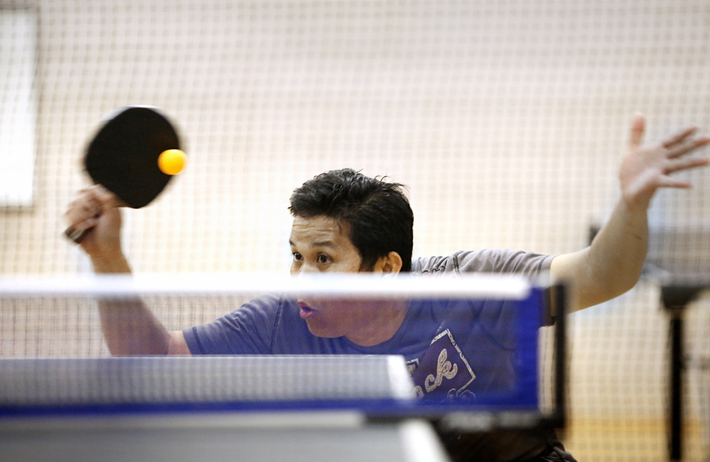 Chris Mesach keeps his eye on the ball during his match.
