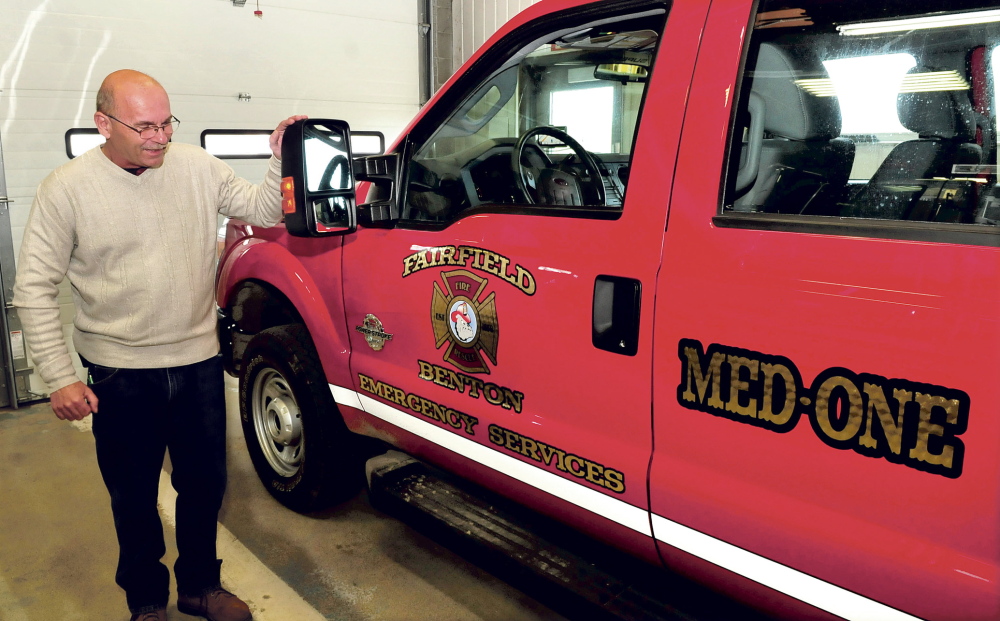 NEIGHBORS: Fairfield Fire Chief Duane Bickford looks over the new Med One truck at the department on Thursday, April 17, 2014. After helping each other fight fires for more than 100 years, Fairfield and Benton have entered into their first formal inter-local agreement under which the Fairfield Fire Department will become Fairfield-Benton Fire Rescue.