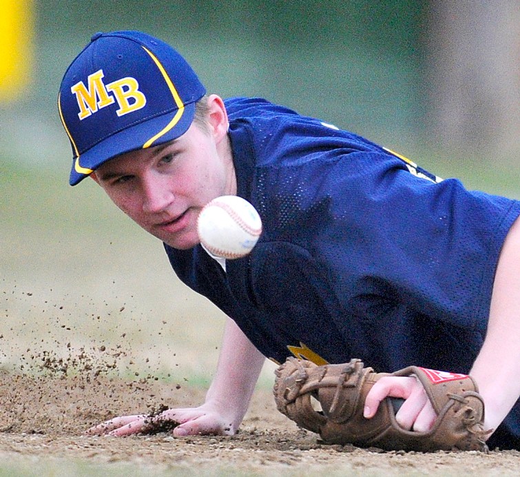 Staff photo by Andy Molloy Mt. Blue first basemen Moses Clark blocks a ball Wednesday during a baseball match up against Cony in Augusta.