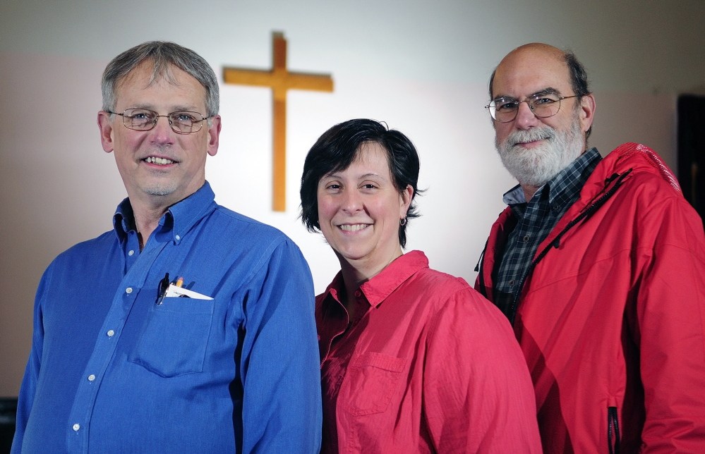 Team leaders: From left, the Rev. Gary York, pastor of Oakland United Baptist Church; Emily Webber, a trustee of Dunn’s Corner Baptist Church in Mount Vernon; and Ted Chaffee, pastor of Gardiner First Baptist Church, pose on Thursday in Readfield. They’re organizing another mission trip to the Lower 9th Ward of New Orleans in August.