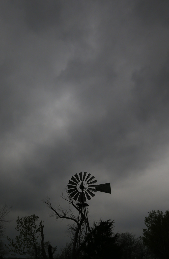 A thunderstorm builds over a farm near Baldwin City, Kan., Sunday.