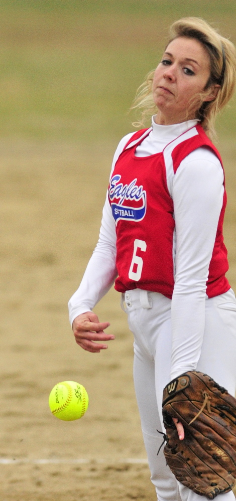 Staff photo by Joe Phelan Messalonskee pitcher Kassi Michaud throws to the plate during a game on Wednesday April 30, 2014 at Cony Family Field in Augusta.