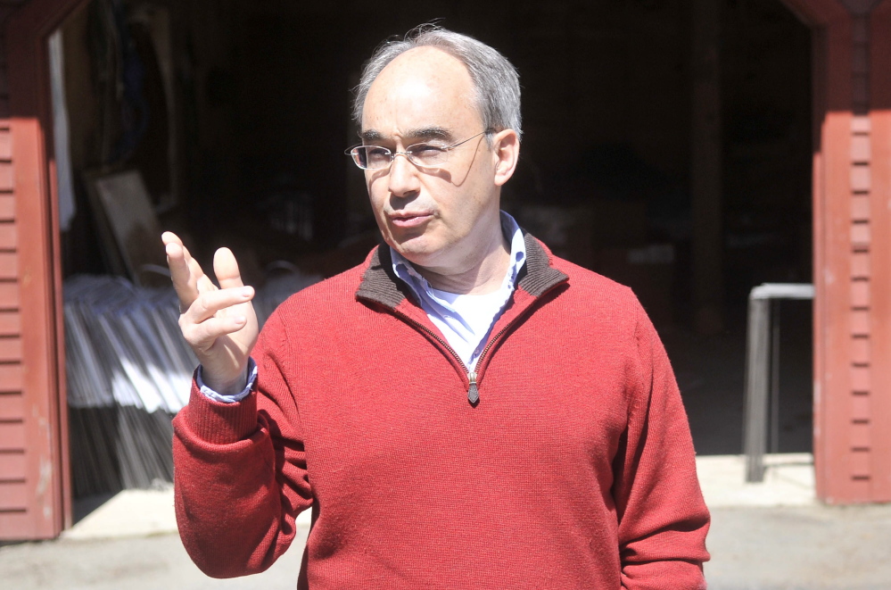Bruce Poliquin, a candidate for the Republican nomination for the 2nd Congressional District seat, talks about his connection to Oakland and Waterville from his driveway in Oakland.