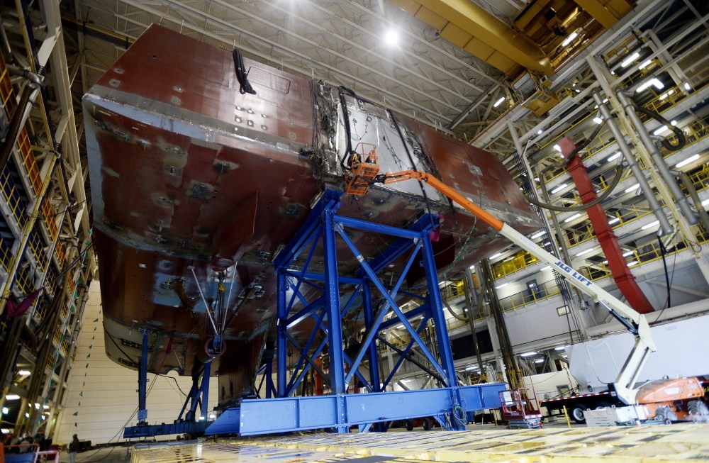 Work is underway on the stern of a DDG-1000 Zumwalt destroyer at Bath Iron Works in Bath on Thursday. Although most new workers have experience or training in their field, shipyard officials have created a facility to help workers tailor their skills to the yard’s needs.