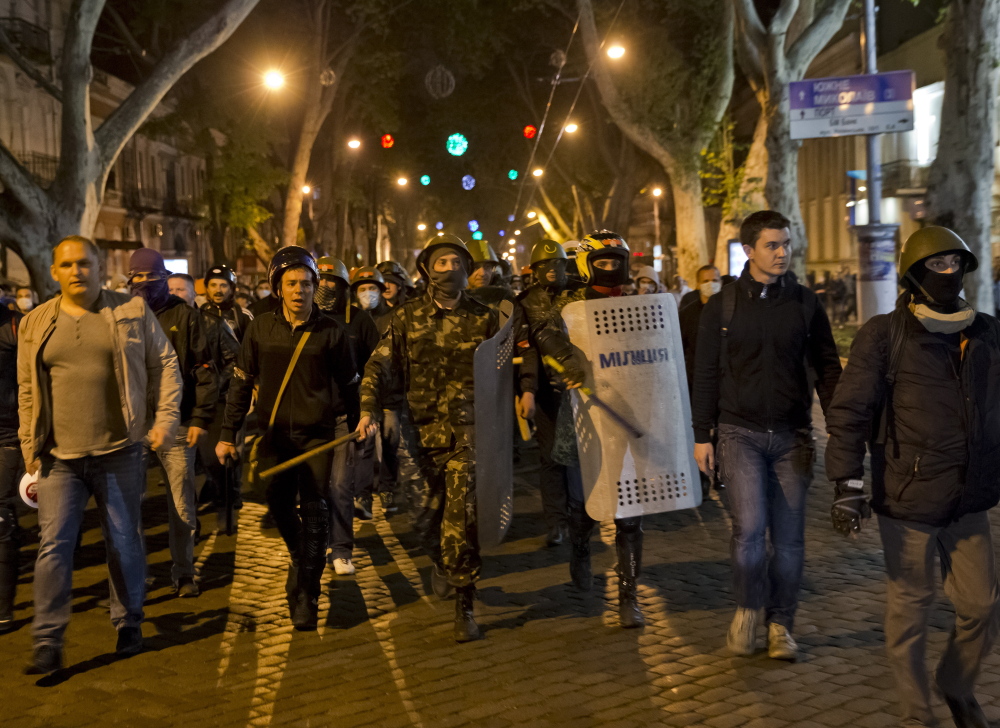 Pro-Ukrainian activists march to the trade union building in Odessa, Ukraine, on Sunday. The building was the scene of a fire and riots in which 40 died two days earlier. Odessa is Ukraine’s third-largest city and most important port.