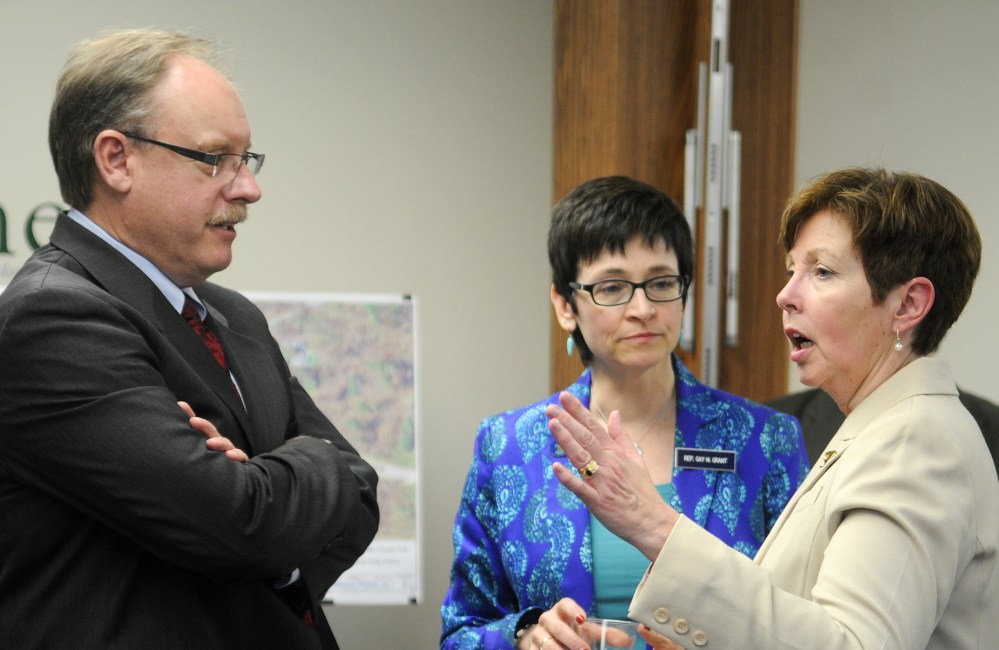 NEW WATER TOWER: Department of Environmental Protection Commissioner Patricia Aho, right, speaks Monday with Rep. Gay Grant, D-Gardiner, and New England Region Environmental Protection Agency Administrator Curt Spalding at city hall in Gardiner following the announcement of a $1.5 million loan to build a water tower in Farmingdale.