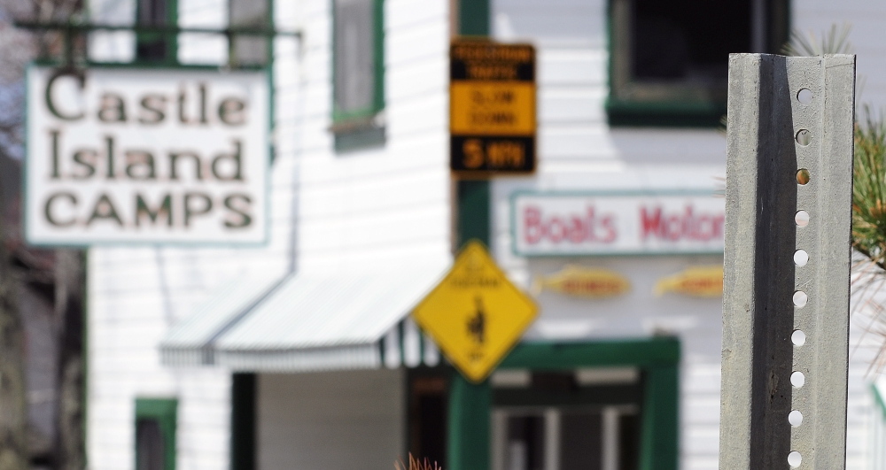 MOVED: The “Pedestrian Traffic Slow Down 5 MPH” sign that had been on a post near Castle Island Camps is now hanging on the building in Belgrade.