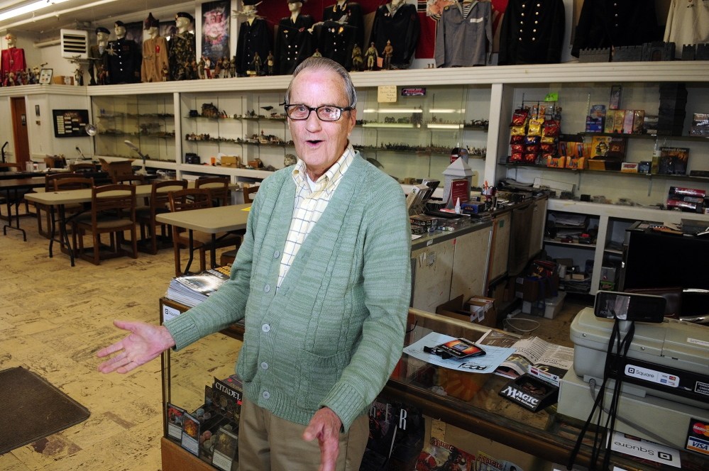 Storefront: Frank Hillman, the owner of 269-273 Water St. in Gardiner, talks about flood insurance rates on Thursday in Gardiner. The storefront there is his son’s business, Greenhouse Games.