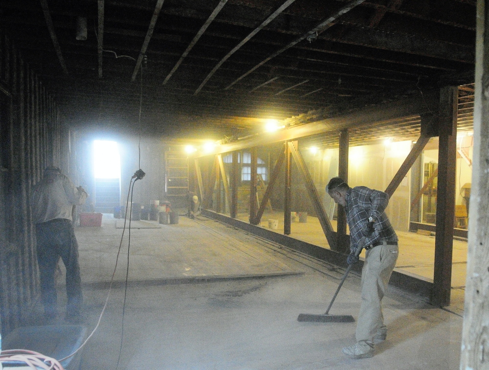 Seating 400: Dust fills the air as volunteers sweep up on the second floor after a pile of lathe and plaster was removed on Saturday, May 10, at Johnson Hall Performing Arts Center in Gardiner. Johnson Hall executive director Michael Miclon said that they’d removed everything that wasn’t structural or historic from the second and third floors of the 1864 building on Water Street in downtown Gardiner. They plan to have the 400-seat theater open again in the next five years, Miclon added.
