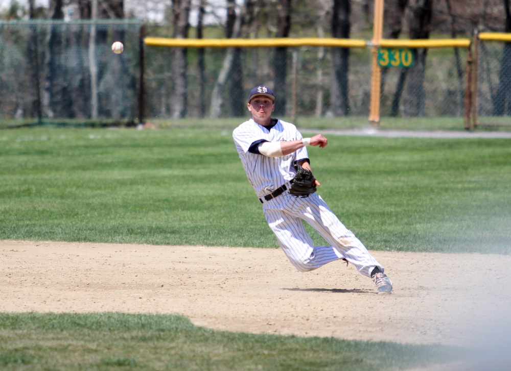 Sam Dexter, a Messalonskee graduate, fields a ground ball and throws to first base during an Eastern regional game last weekend. Dexter and the Huskies are off to the Division III college world series.