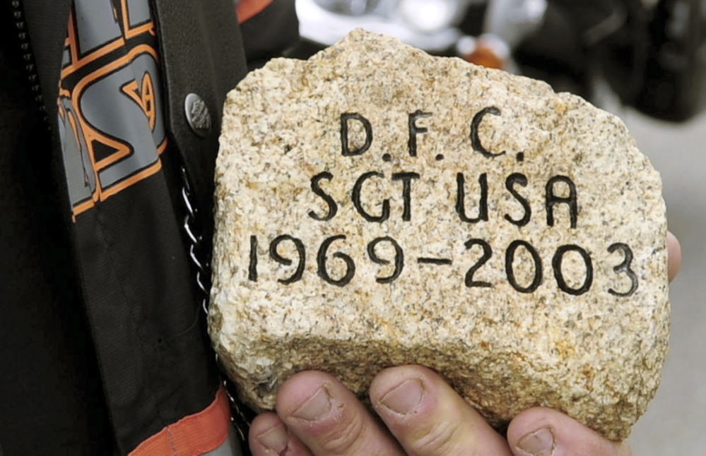 RECALLING A SOLDIER: David Boyd talks about Army Sgt. Daniel Cunningham’s stone during a stopover by The Summit Project convoy on Friday at the West Gardiner rest area off the Maine Turnpike.