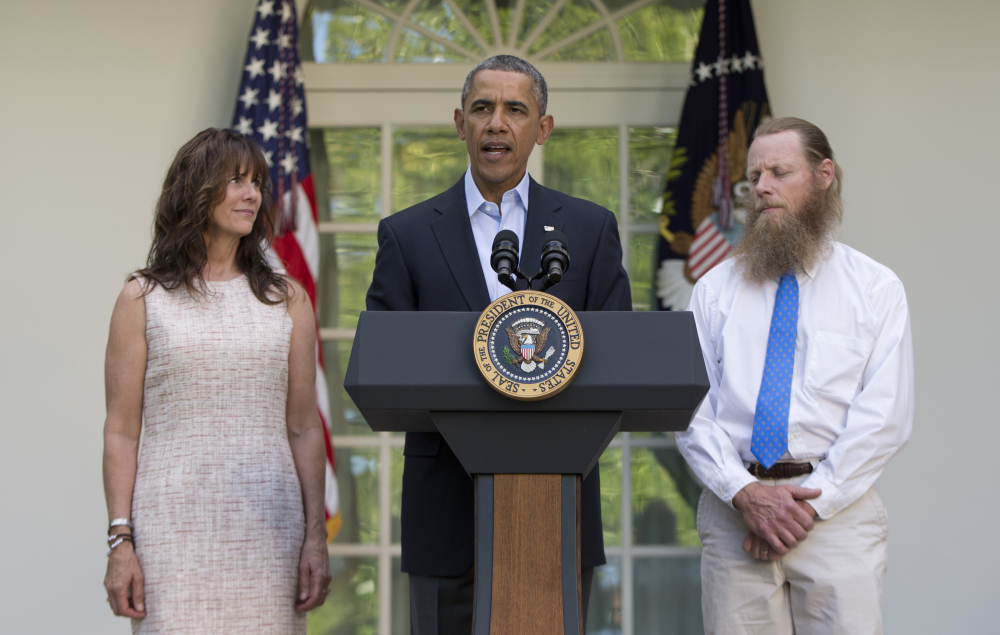 President Barack Obama speaks with Jani Bergdahl, left, and Bob Bergdahl, right, in the Rose Garden of the White House in Washington on Saturday after the announcement that their son, U.S. Army Sgt. Bowe Bergdahl, was released from captivity.