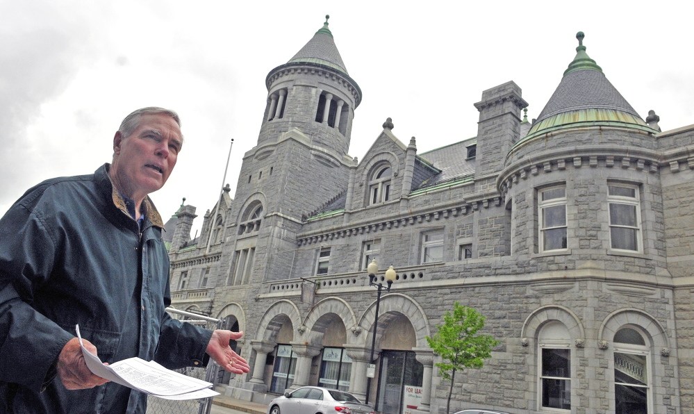 Tour Guide: Christopher Closs, field service advisor for Maine Preservation, talks about the Olde Federal Building office complex at the corner of Winthrop and Water Streets during a walking tour Saturday of 12 downtown Augusta buildings that are on the National Register of Historic Places.