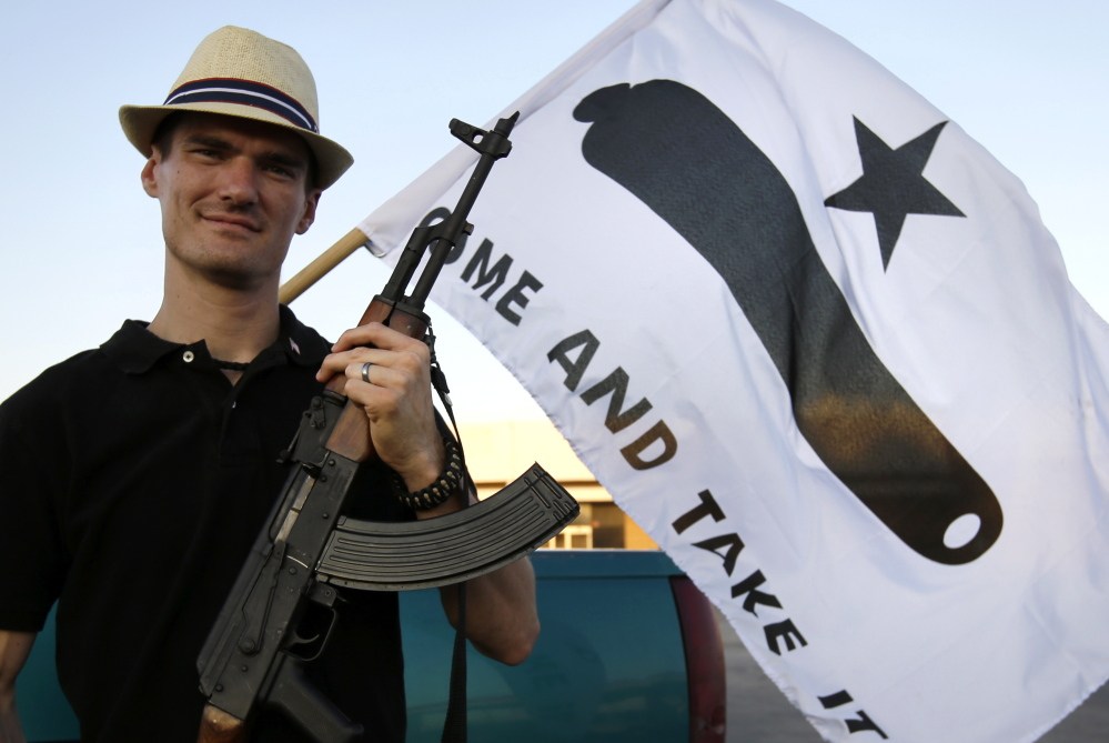 Open Carry Texas members like Kory Watkins are pushing for the right to carry their long-barrel guns in Texas without a permit. The group has demonstrated at chain stores and restaurants by bringing the weapons with them, which drew a rebuke from the NRA.