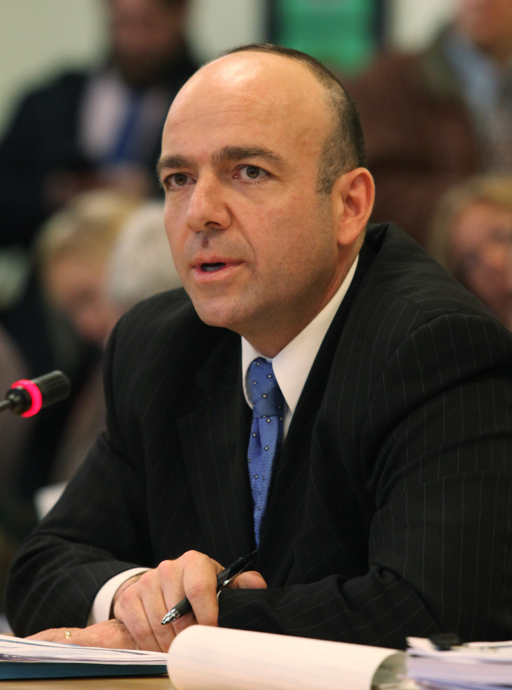 Gary Alexander, a consultant hired by the LePage administration, appears before the Health and Human Services Committee Tuesday Jan. 14, 2014 in Augusta, Maine. (AP Photo/Joel Page)