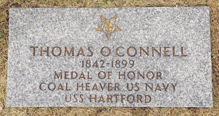 Staff photo by Joe Phelan HONORED: Town cemetery sexton Tom Reed recently installed a new marker for Thomas O’Connell, who won the Medal of Honor in the Civil War and is buried in Rest Haven Cemetery in Windsor.