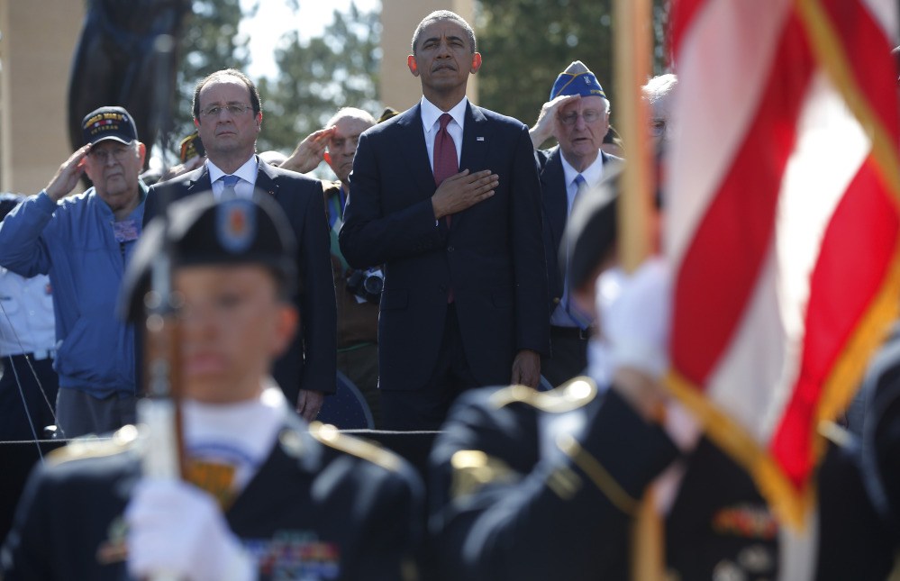 The Associated Press President Obama and French President Francois Hollande stand during the playing of the “Star Spangled Banner.”