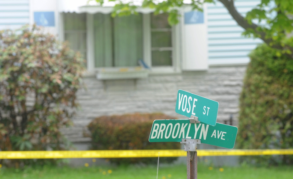 Staff photo by Michael G. Seamans Crime scene: Investigators at the residence of Aurele Fecteau, 92, who was found dead in his home on Brooklyn Street in Waterville on Friday, May 23.