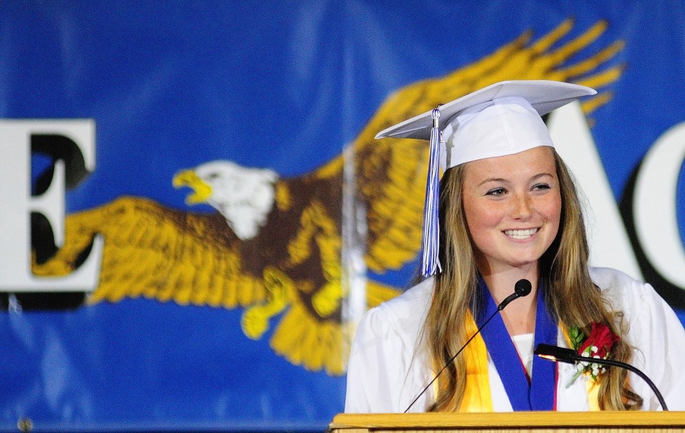 Staff Photo by Joe Phelan GRADUATION: Erskine Academy senior Emma Wilkinson gives the second honor essay during graduation on Friday at the Augusta Civic Center.