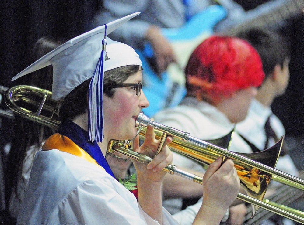 Staff Photo by Joe Phelan Graduation: Erskine Academy senior Kala Freytag Wistar warms up with the concert band before graduation ceremony on Friday at the Augusta Civic Center. They played two songs during the ceremony.
