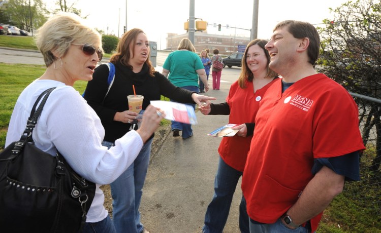 Kevin Bennett Photo Stretch Run: Troy Jackson, right, greets nurses Wendy Cooper-Plaisted, left, and Michelle Pullen, second from left, in front of Eastern Maine Medical Center in Bangor recently. With Jackson is Jenn Sedgwick, chief steward of the Maine State Nurses Association. Jackson hopes to get a boost from union members as he campaigns for the 2nd Congressional District.