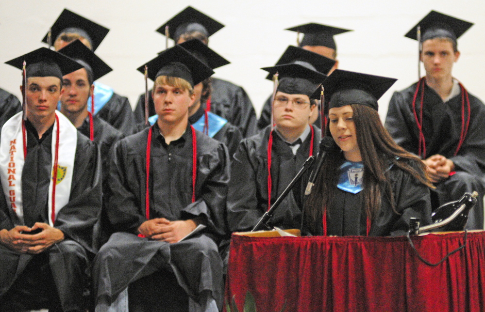 Staff photo by Joe Phelan Words of wisdom: Honor Essayist Erin Ballew gives her speech Saturday evening at Hall-Dall High School’s graduation ceremony in the school’s Penny Memorial Gymnasium in Farmingdale.