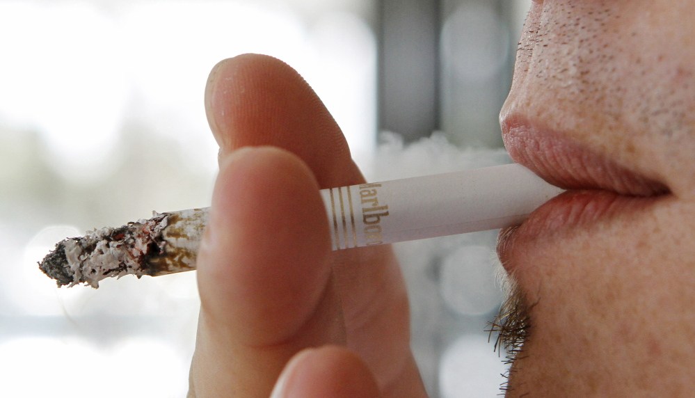 The Associated Press A man smokes a Marlboro cigarette in Hialeah, Fla. The Supreme Court has turned away appeals from cigarette manufacturers of more than $70 million in court judgments to Florida smokers.