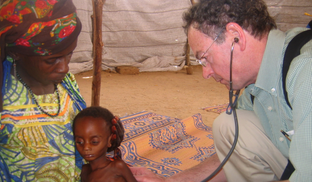 Richard Rockefeller treats a Nigerian child during a meningitis outbreak. Rockefeller died Friday in a plane crash in Westchester, N.Y., on his way to Portland.