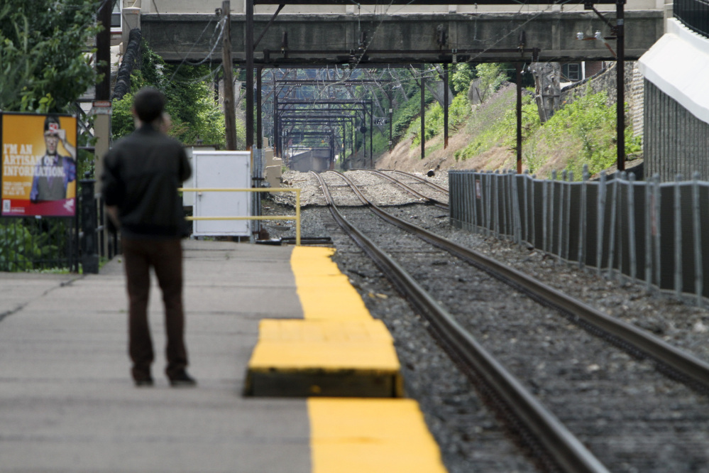 Unaware of the work stoppage Roy Pearson waits for a SEPTA commuter train at the East Falls commuter rail station in Philadelphia on Saturday.