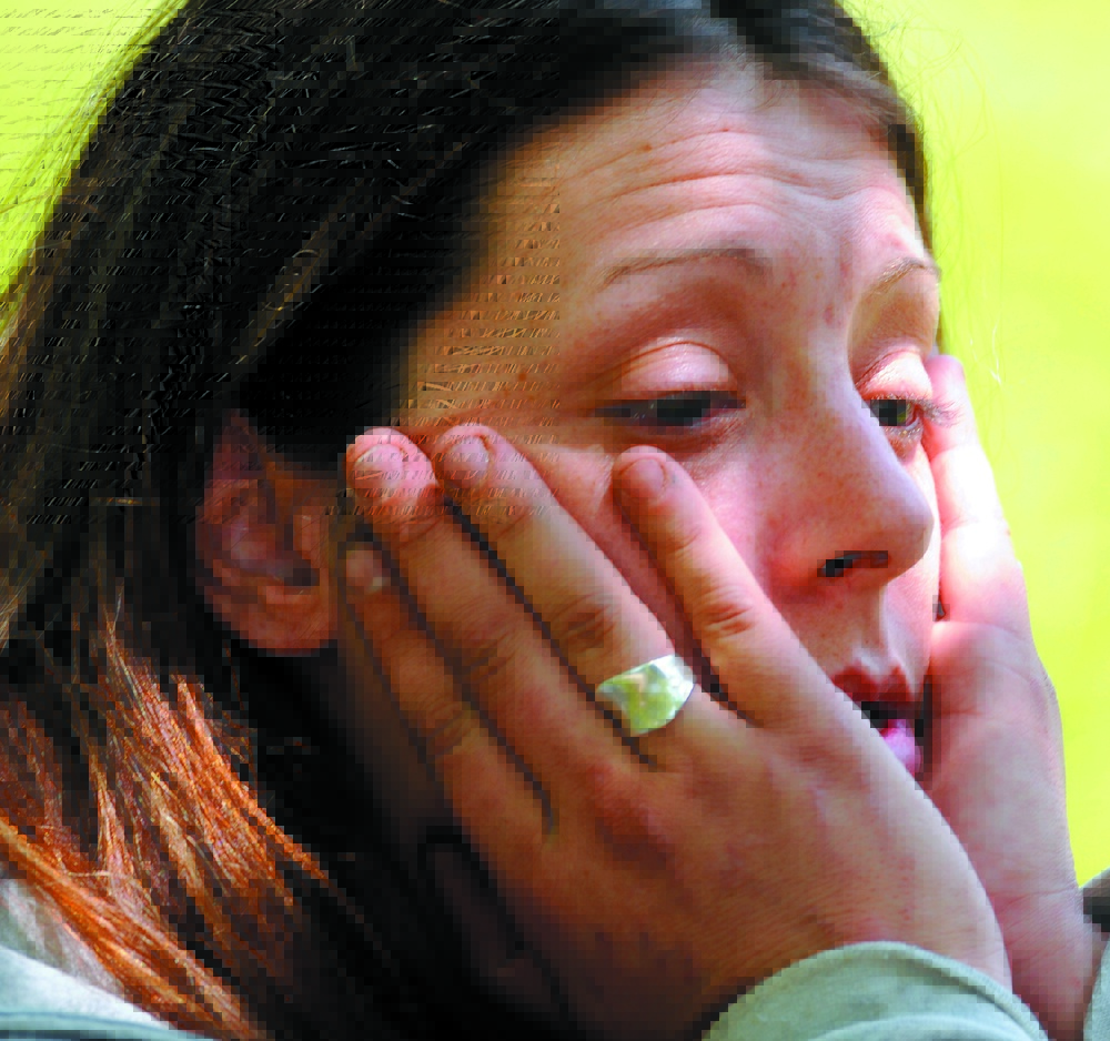 DRUG ARREST: Jennifer Dowling waits to be transported to jail after being arrested by Augusta police in June 2012 on drug possession charges after drug agents and Augusta police executed a search warrant at 21 Glenwood St., Augusta.