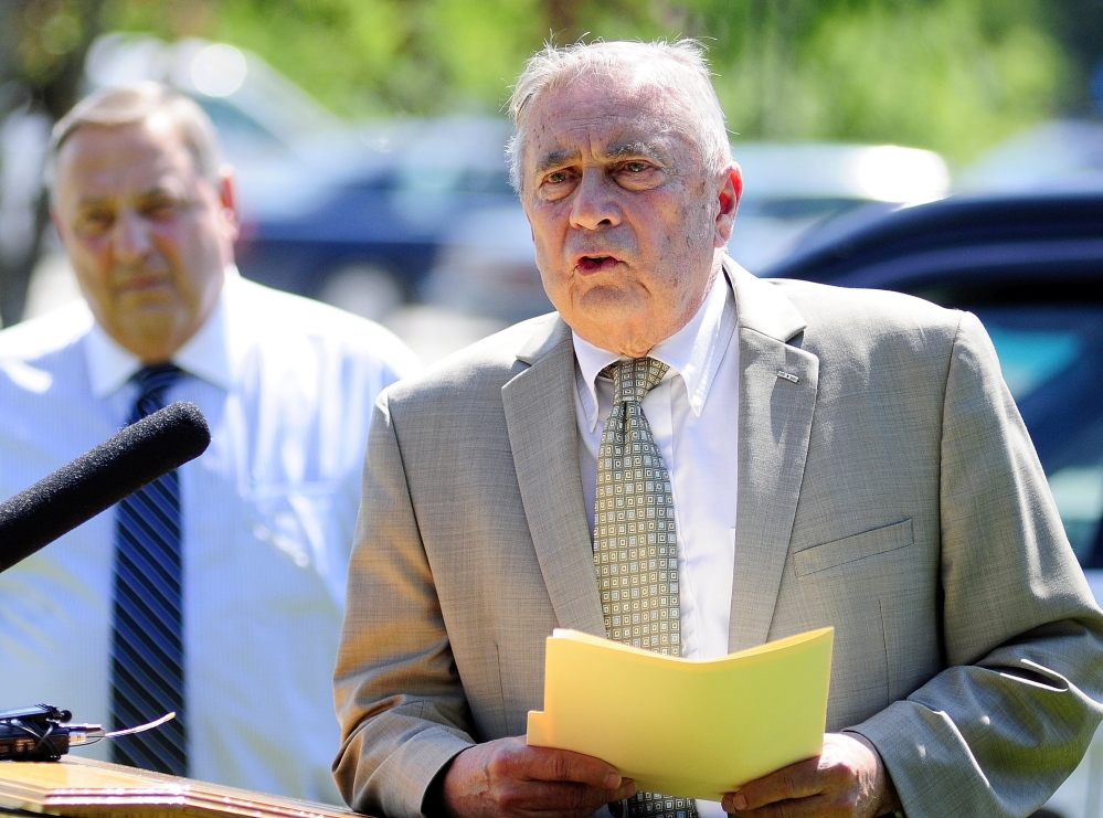 Crime Statistics: Gov. Paul LePage, left, listens as Public Safety Commissioner John Morris talks during a news conference held to announce that crime in Maine decreased 9.1 percent in 2013.